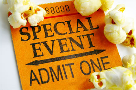 Image of a paper admission ticket surrounded by pieces of popcorn.